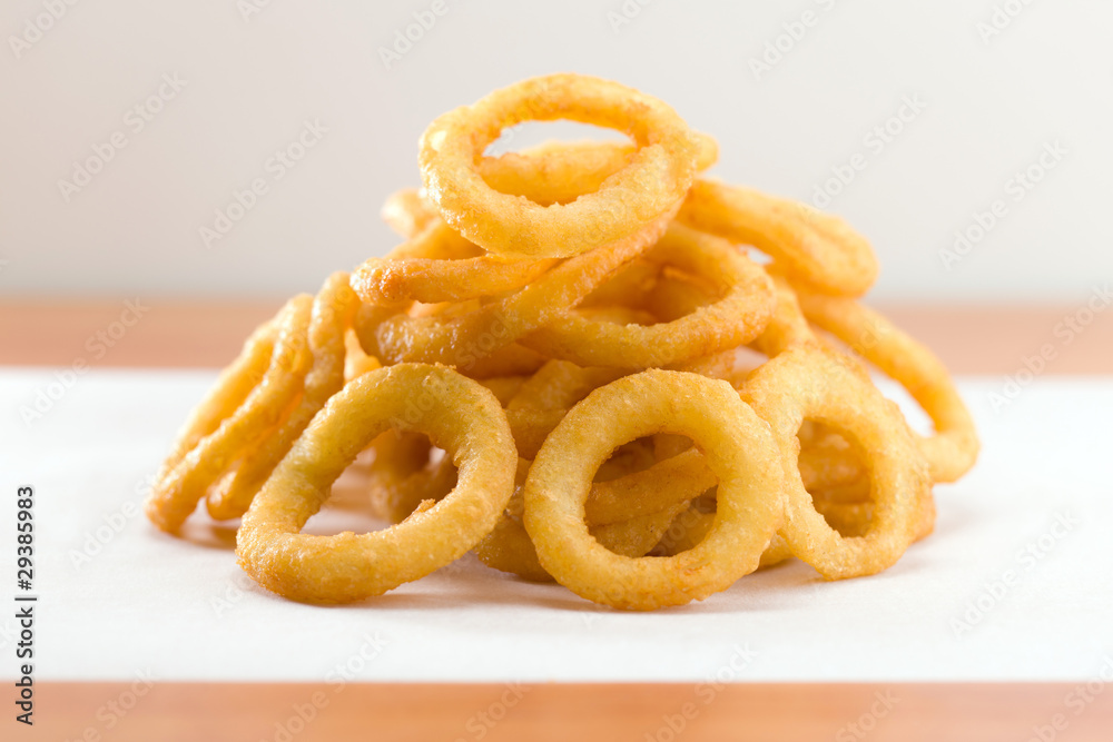 Onion ring on a waxed white paper Onion ring on a waxed white paper