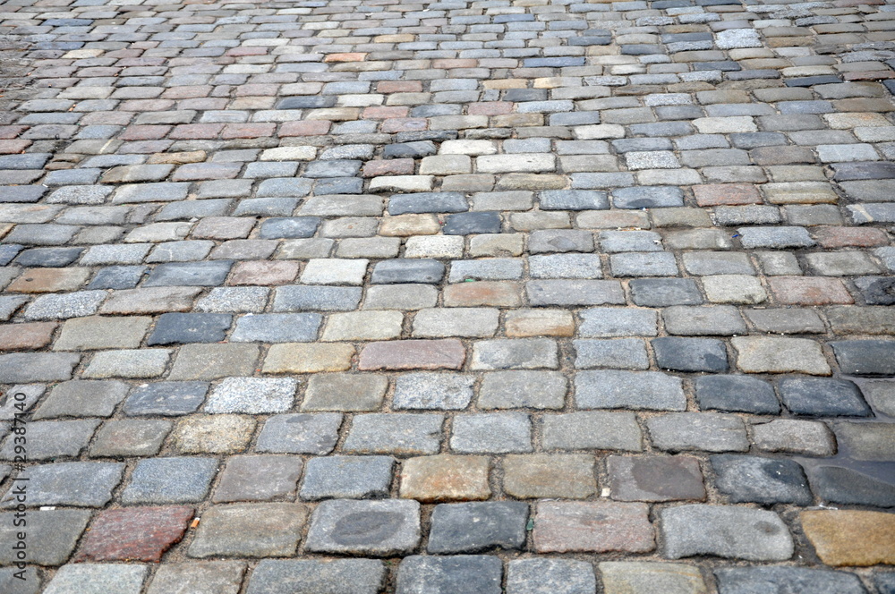 Stone sidewalk in Poznan Old Market, Poland as a background Stone sidewalk in Poznan Old Market, Poland as a background