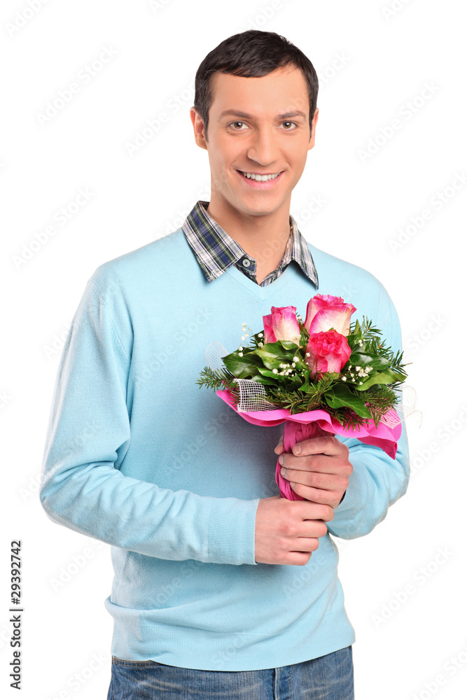 Young smiling man holding a bouquet of flowers Young smiling man holding a bouquet of flowers
