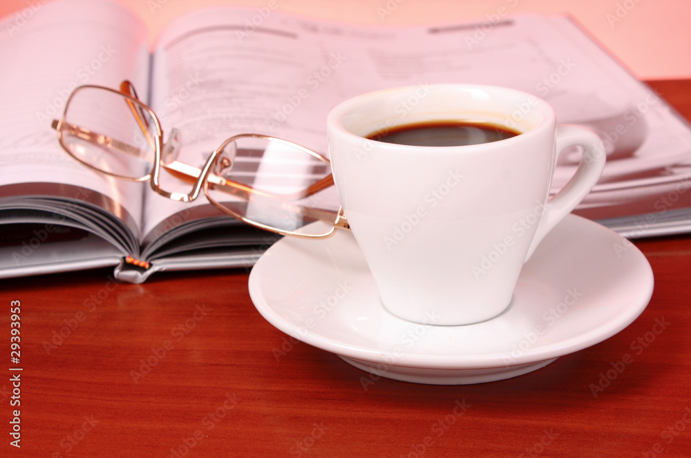 Cup of coffee, book, clock and calculator on wooden table Cup of coffee, book, clock and calculator on wooden table