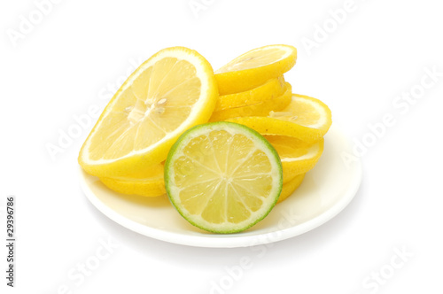 Sliced Lemon And Lime on Plate Isolated on White Background