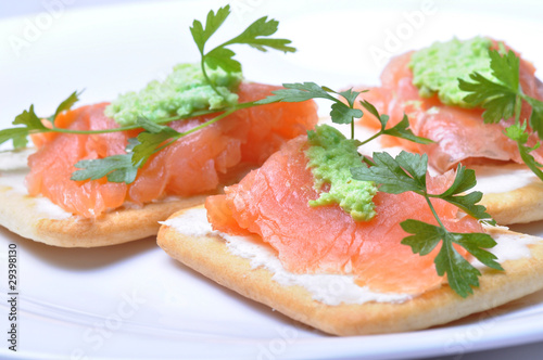 smoked salmon with wasabi on cracker isolated