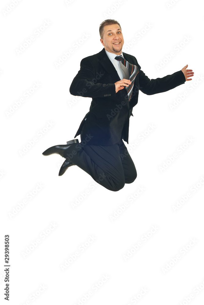 Mid adult business man jumping