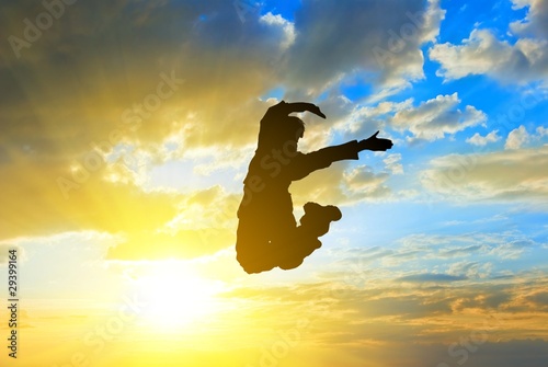 people jumping on a sunny sky background