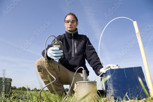 Taking samples of the soil and groundwater, environmental resear