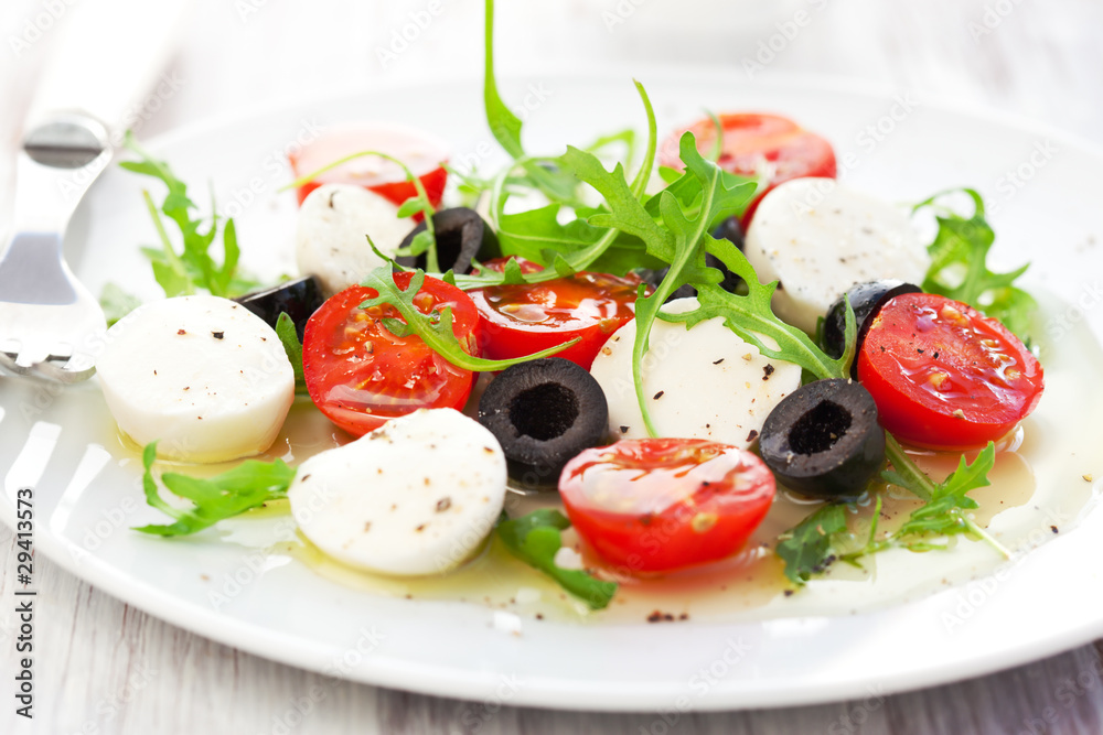 salad with mozzarella, tomatoes and black olive