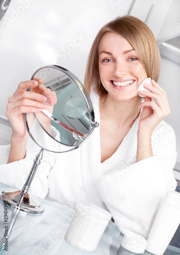 woman taking care of her face