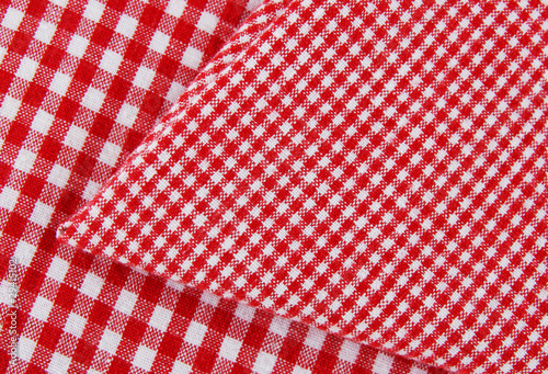 red and white napkin on tablecloth
