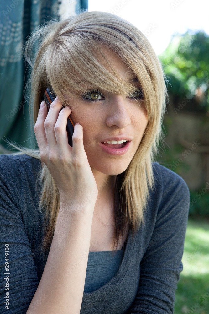 Fototapeta premium Teenager Talking on Mobile Cell Phone