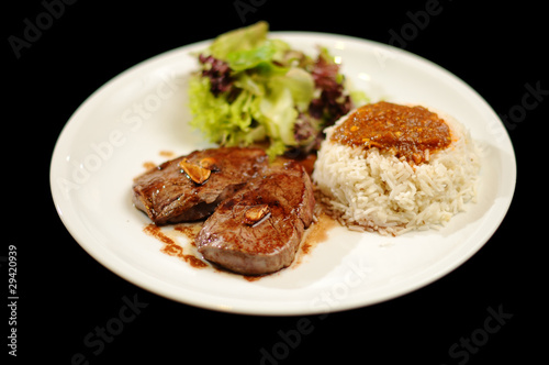 Steak meal with rice and salad