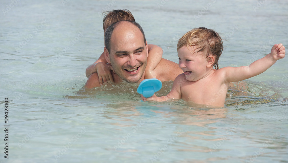 happy family playing in water