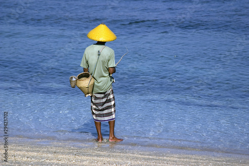 Fisherman on the beach photo