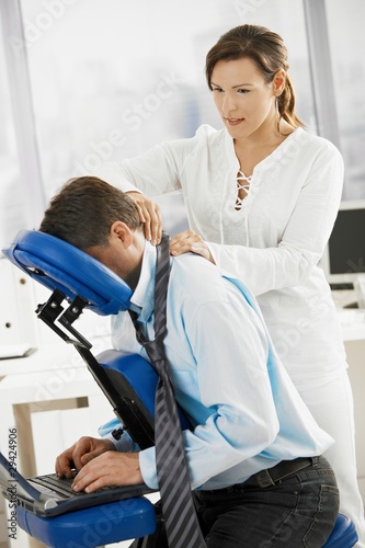 Businessman getting massage in office