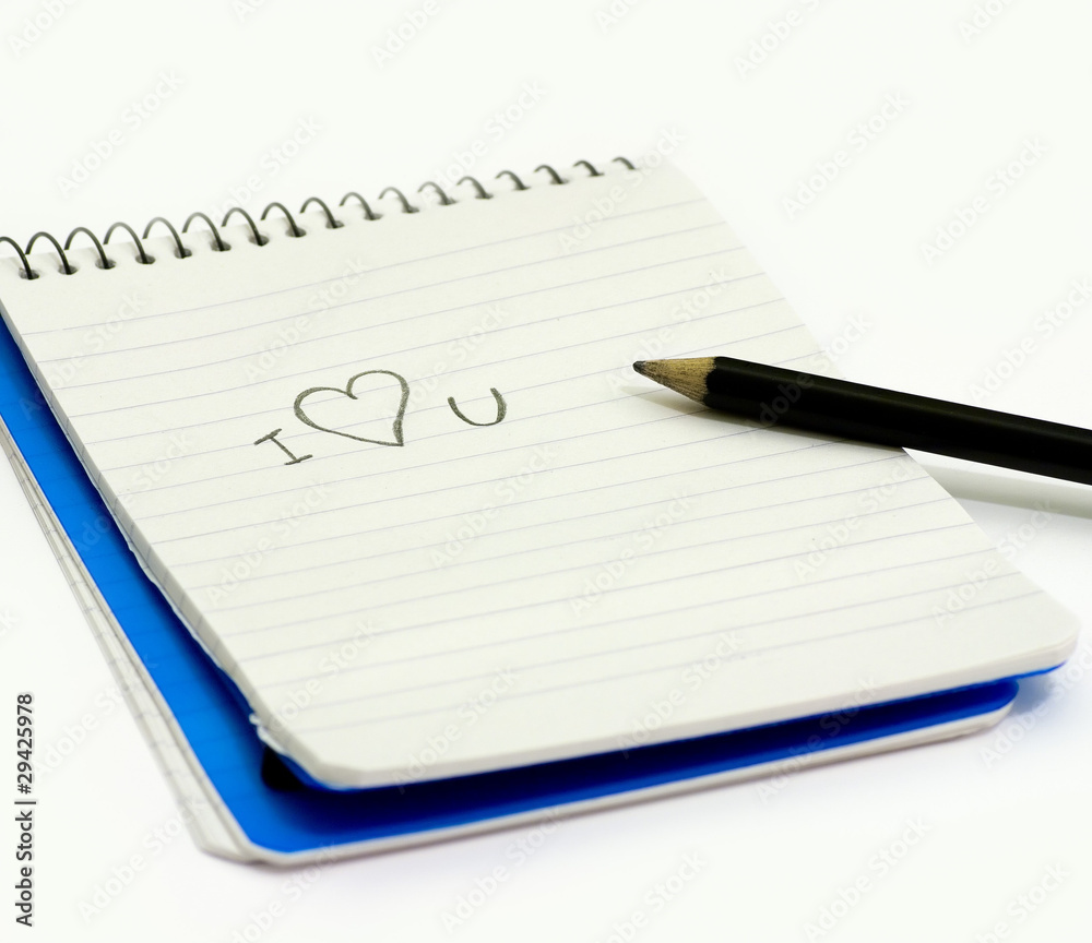Pencil and small notebook with a love valentine message Pencil and small notebook with a love valentine message
