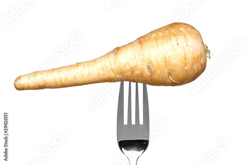 Parsnip on a fork isolated on white