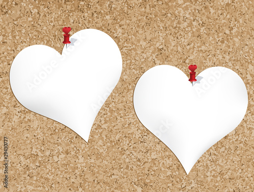 Cork bulletin board with heart shaped notepads photo