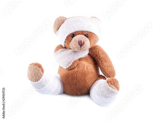 Sick teddy bear wrapped in bandages