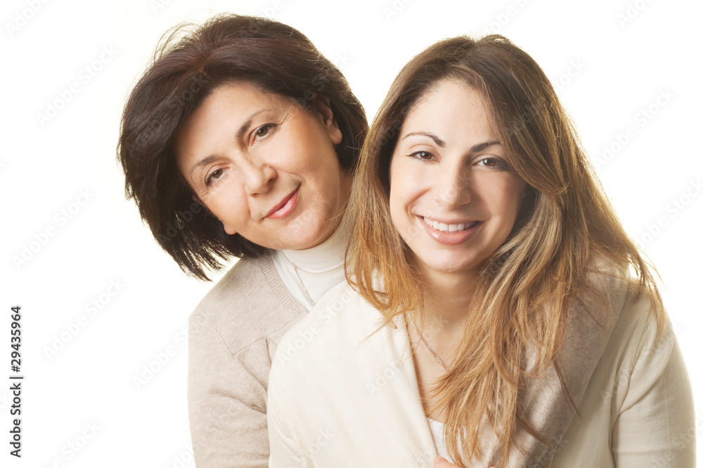 Mother and daughter hugging against white background Mother and daughter hugging against white background