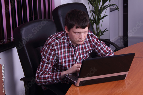 young man with a laptop