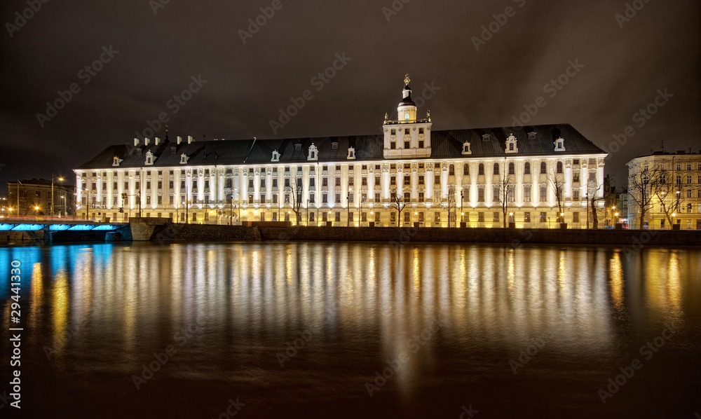 Night view on big building and river