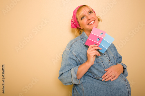 Pensive Pregnant Woman Hold...