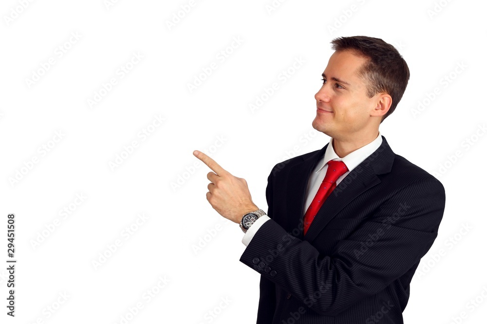 Handsome young man in a suit pointing up and smiling Handsome young man in a suit pointing up and smiling
