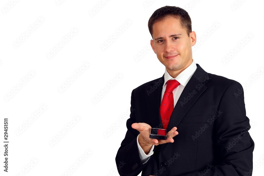 Handsome young man in a suit giving you a smartphone
