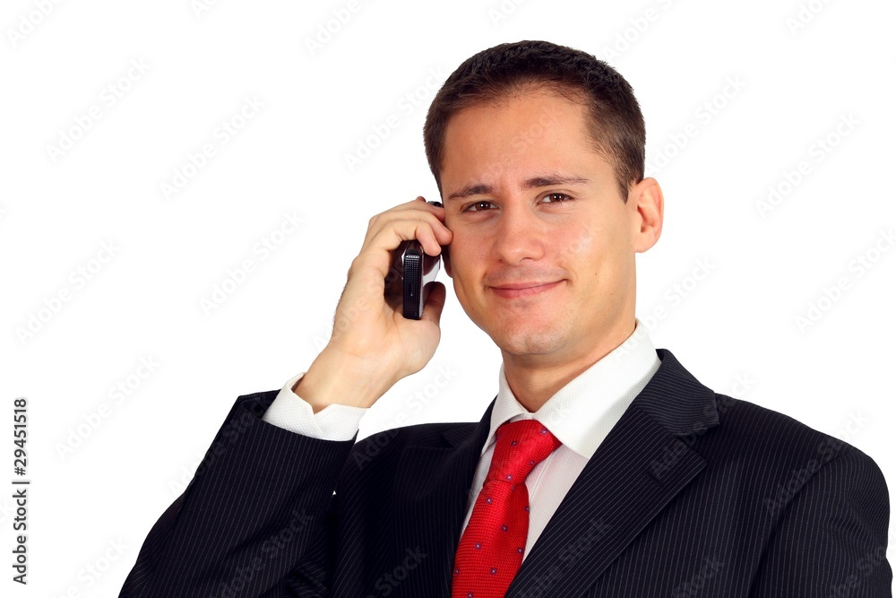 Handsome young man in a suit talking on his mobile phone Handsome young man in a suit talking on his mobile phone