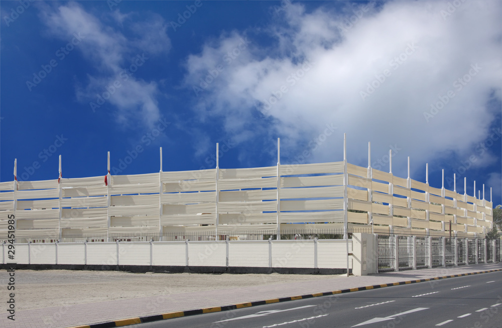 Flag hoisting posts with interlocking high canvas fence Flag hoisting posts with interlocking high canvas fence