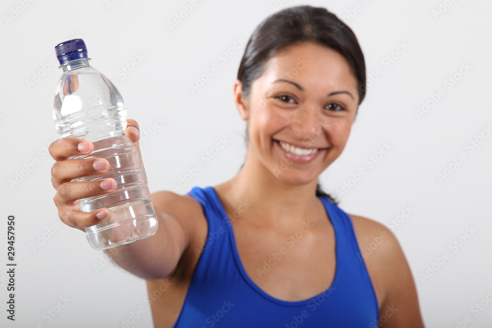 Bottle water held by beautiful smiling young woman Bottle water held by beautiful smiling young woman