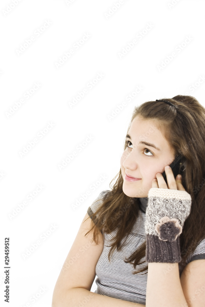 Cute young teenage girl talking on a cellphone Cute young teenage girl talking on a cellphone