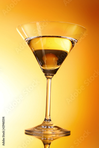Martini glass on yellow background