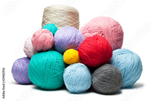 colorful balls of woollen threads isolated over white