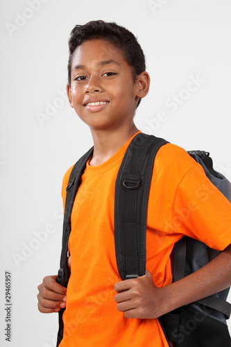 Smiling school boy 11 with rucksack ready to go