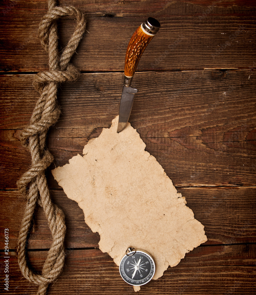 Old paper pinned to a wooden wall with a knife Stock Photo | Adobe Stock
