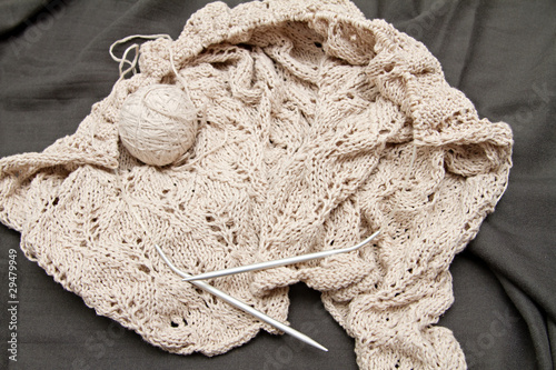 Canvas Print a beige knitted shawl with round needles