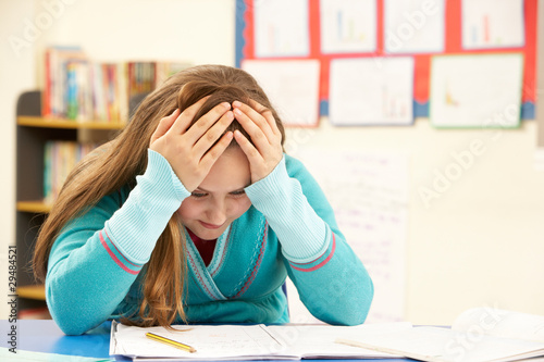 Stampa su tela Stressed Schoolgirl Studying In Classroom