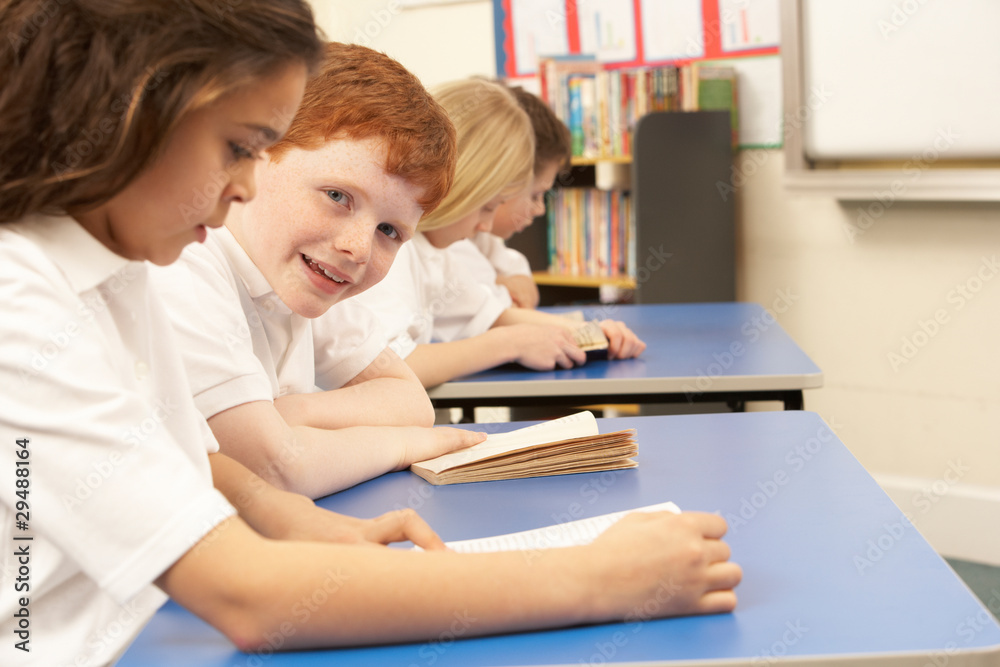 Group Of Children Reading Books In Classroom Group Of Children Reading Books In Classroom