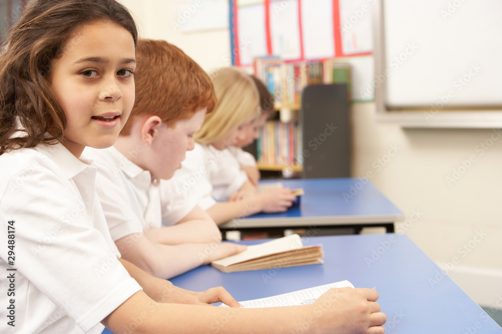 Group Of Children Reading Books In Classroom Group Of Children Reading Books In Classroom