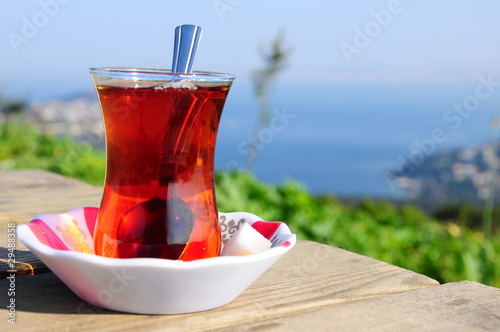 a glass of tea on wooden table photo