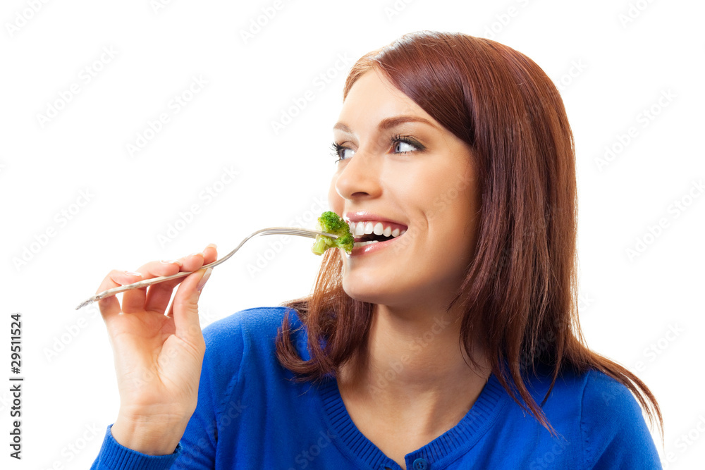 Young happy woman eating broccoli, isolated on white Young happy woman eating broccoli, isolated on white