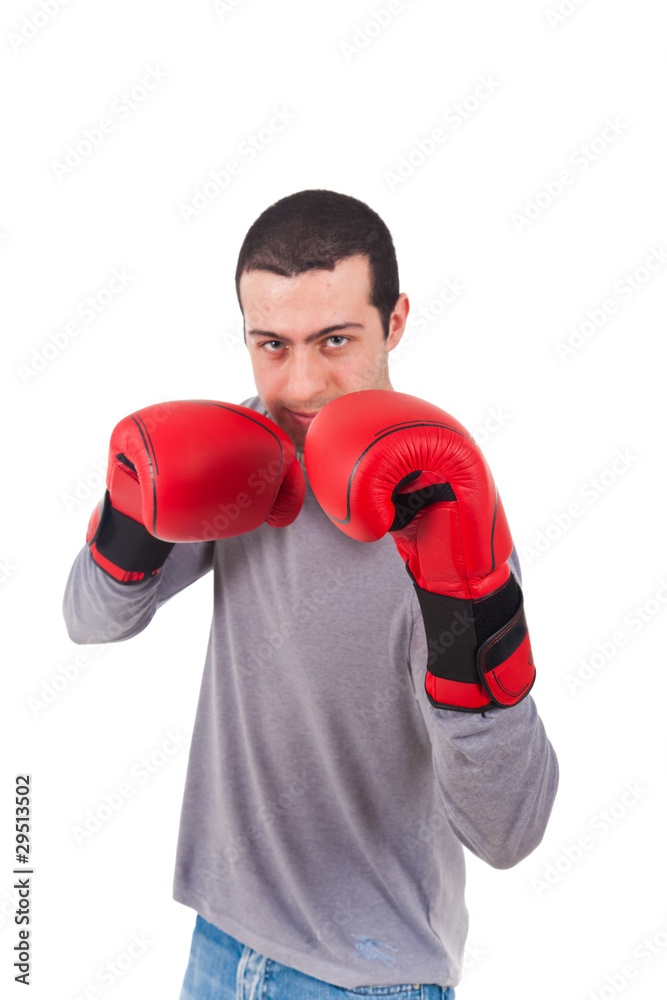 Portrait of young man with boxing gloves over white background