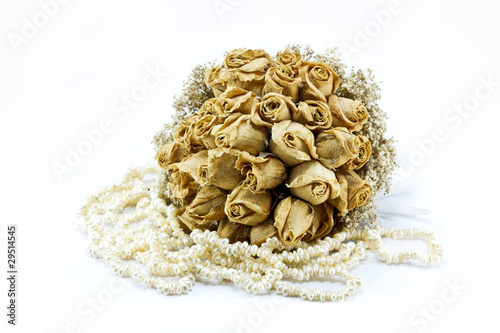 Dried roses bouquet isolated on white background