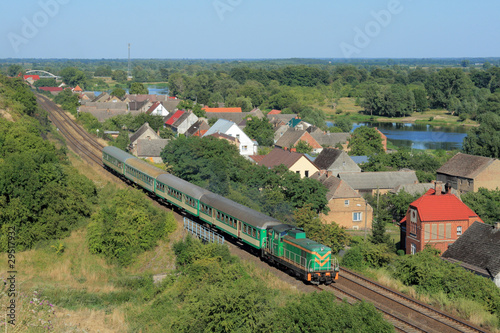 Landscape with the train, village and river