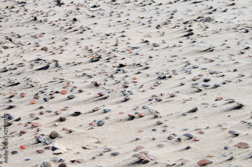 Texture of sand and stones on the beach