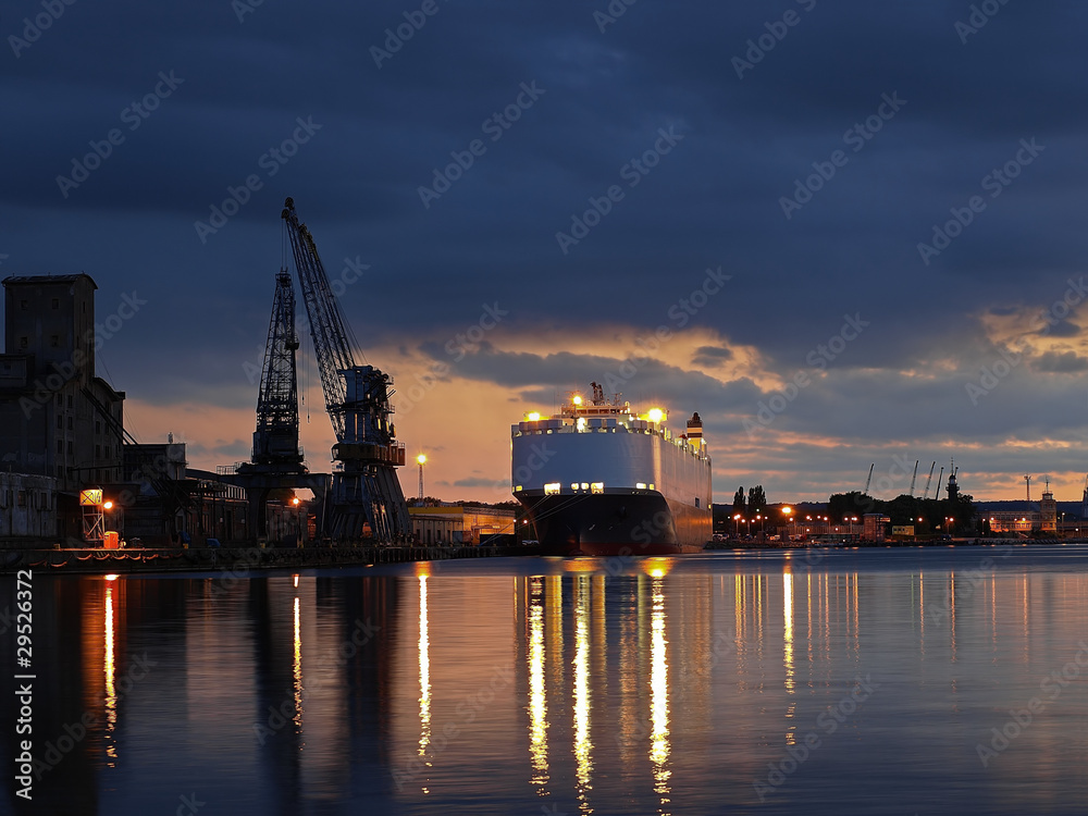 A ship carrying cars, berthed at the port of Gdansk, Poland.