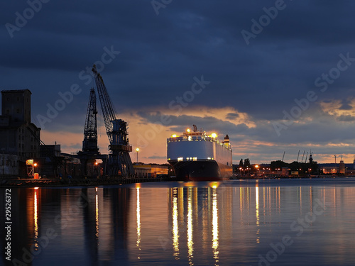 Obraz na płótnie A ship carrying cars, berthed at the port of Gdansk, Poland. w salonie