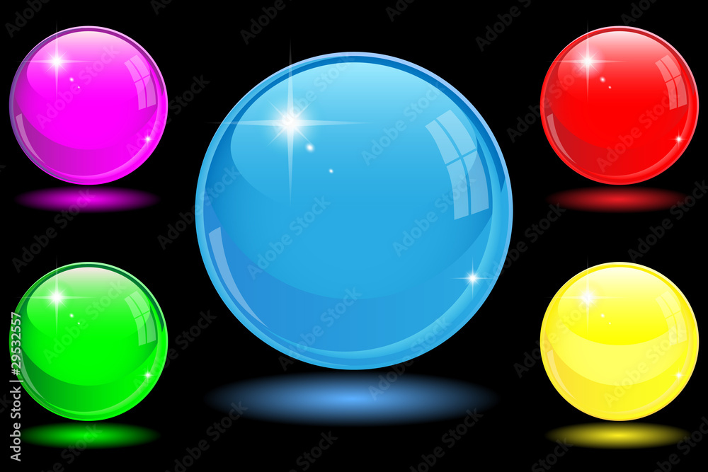 Collection of colorful glossy spheres isolated on black.