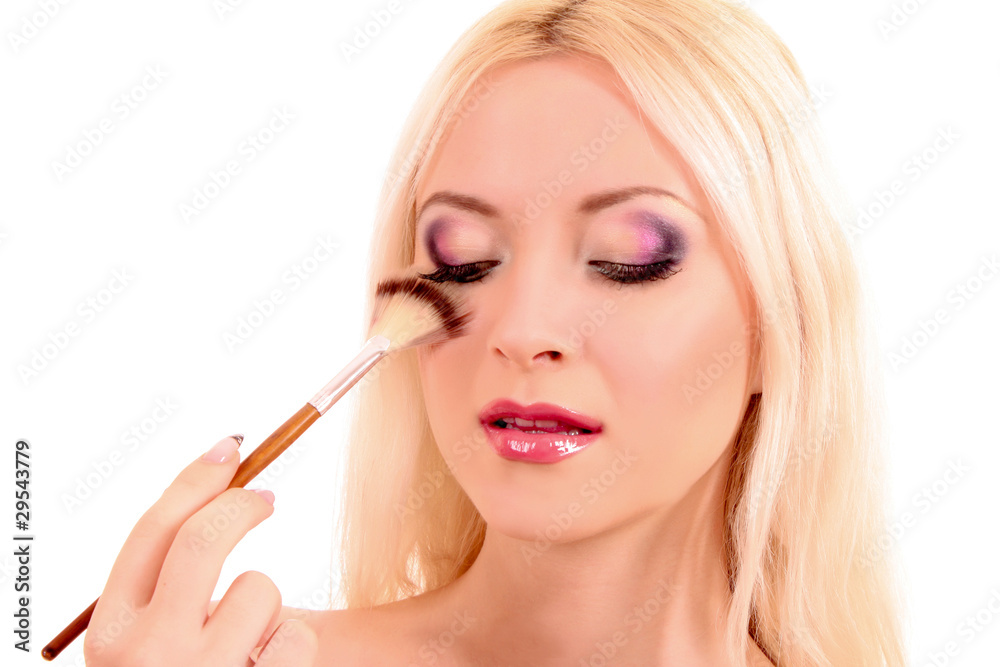 Young beautiful woman with brush for make-up isolated on white Young beautiful woman with brush for make-up isolated on white