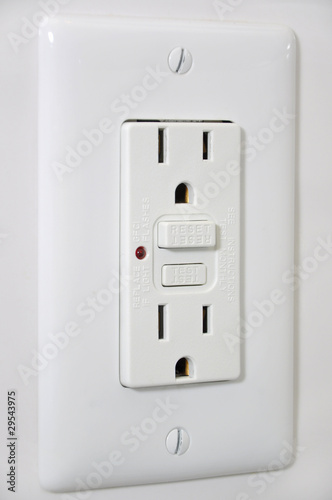 Outlet with secured button photo